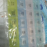 Transparent 7-day pill storage box with 4 rows for easy medication management.