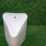 Bright multi-colored hanging planter for plants.