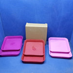 Various colors of square plastic plates.