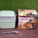 green lunch box with spoon 