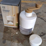 Small ice crusher for homemade shaved ice, manual operation.
