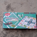 Plastic money coins and game board with game pieces for business game